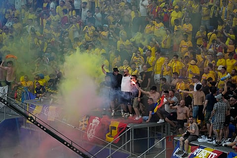 Romania fans cheer during a Group E match against Slovakia at the Euro 2024 soccer tournament in Frankfurt, Germany, Wednesday, June 26, 2024. 